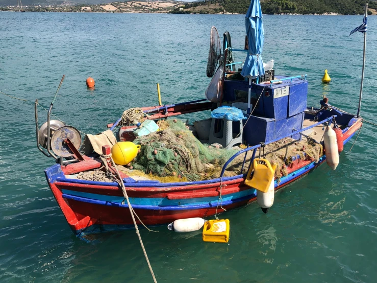 an empty boat tied up on a dock