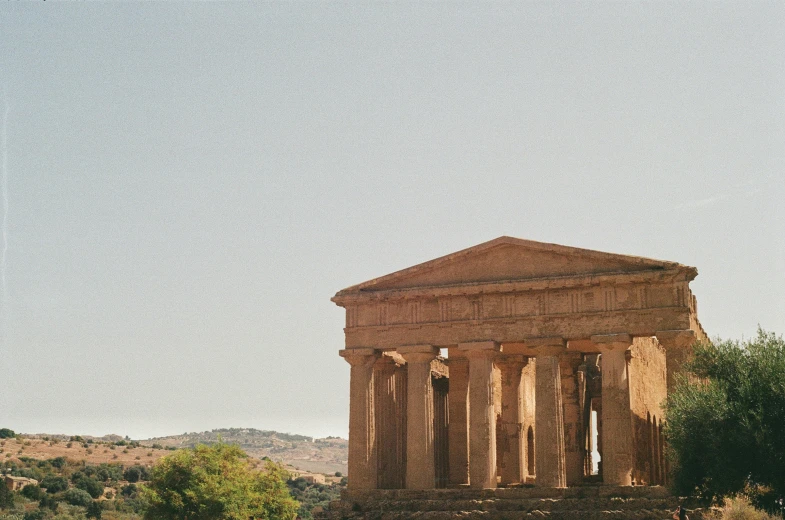 a temple surrounded by trees in the country