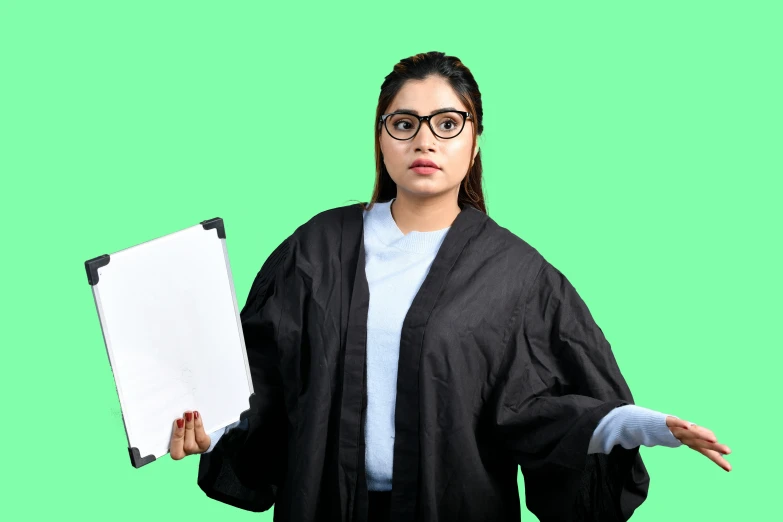 a woman with glasses holds an object