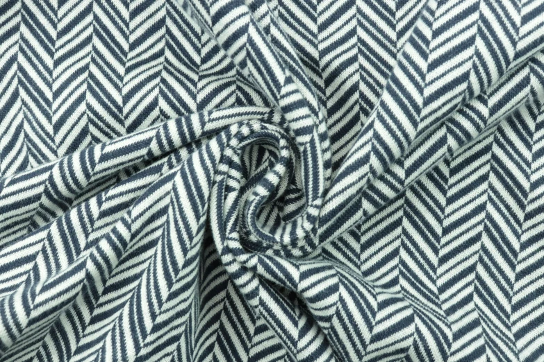 the texture of a blue and white striped fabric with a slight pattern