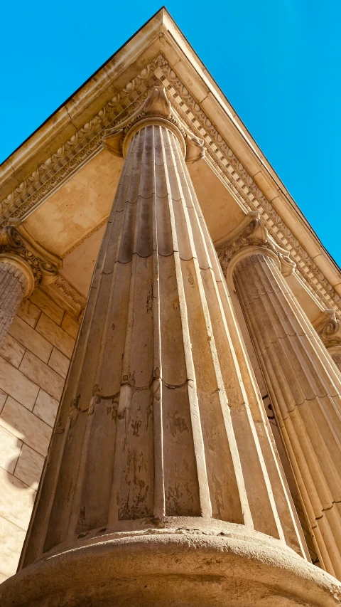 an old column sits in the sun in the city