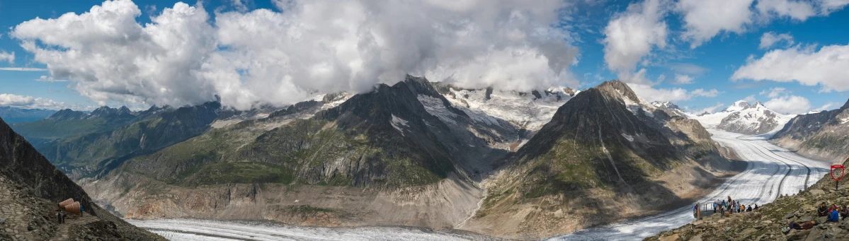 a group of hikers hike through the mountains with some snow in their hands