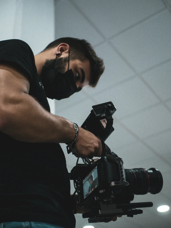 a man is standing in front of his camera