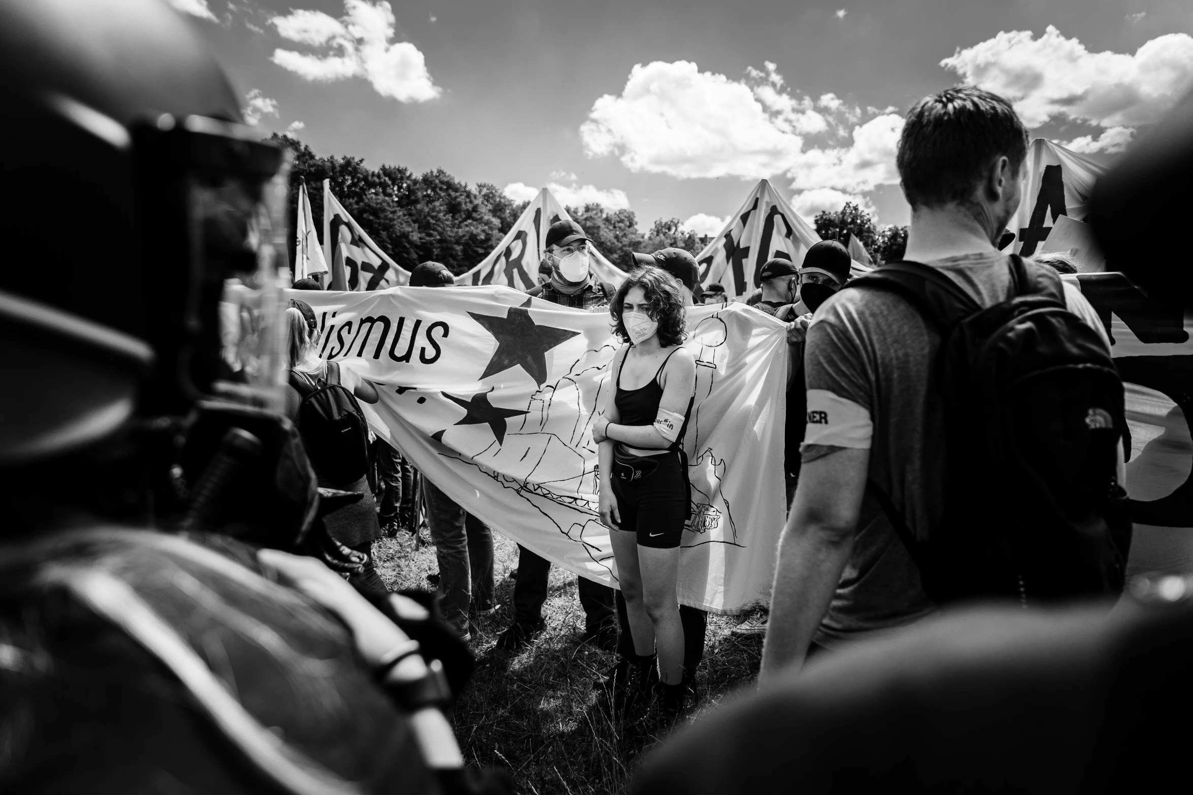 black and white po of people carrying a protest sign