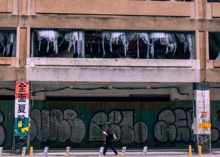 the windows of a large building are covered in icicles