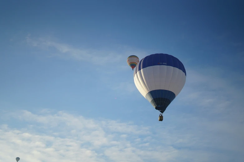 two  air balloons flying in the sky