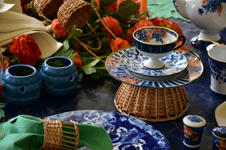 a table topped with lots of cups and dishes