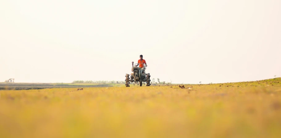 a man is riding a horse on a ranch