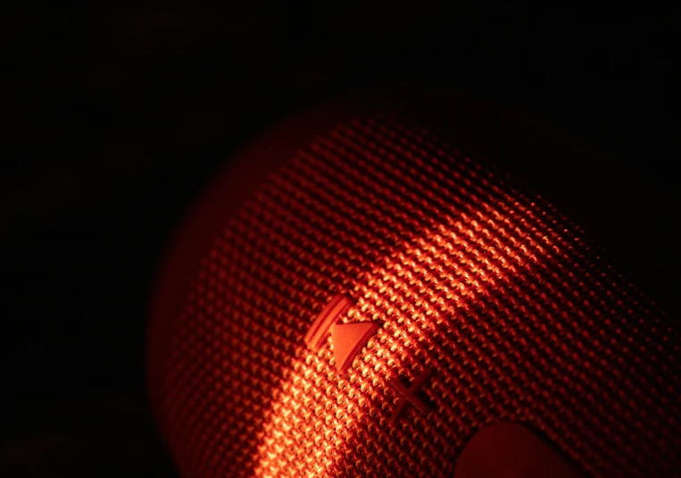 the bright light from a street sign casts an image of a red light