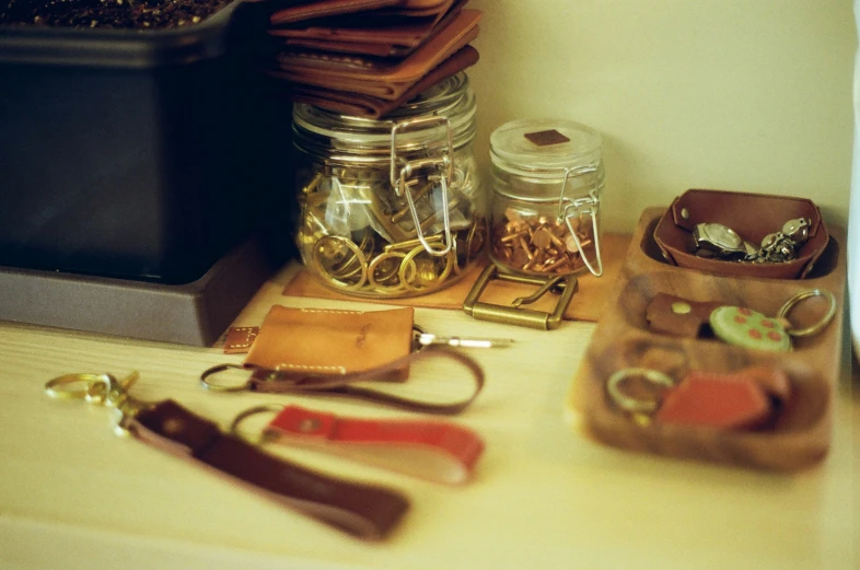 a wooden table topped with a couple of small bags