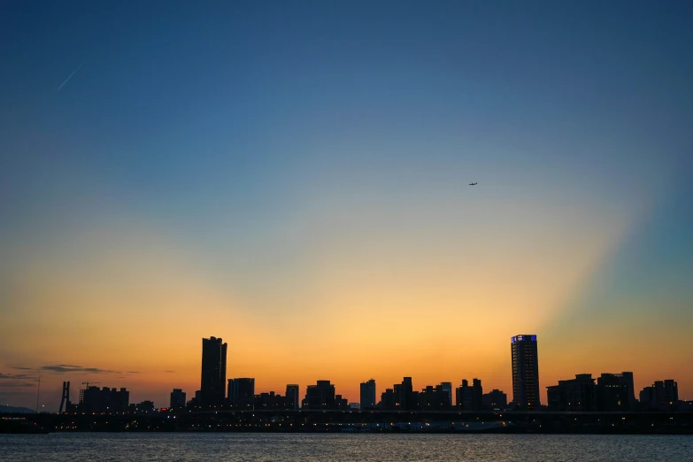 this is a pograph of the city skyline during sunset