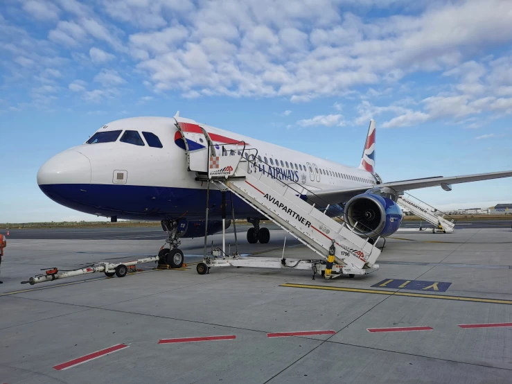 a large passenger airplane sitting on top of an airport tarmac