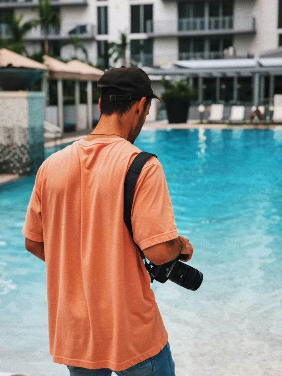 an image of a man standing at a pool