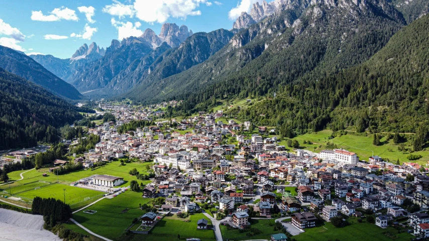 a small village surrounded by a large mountainside