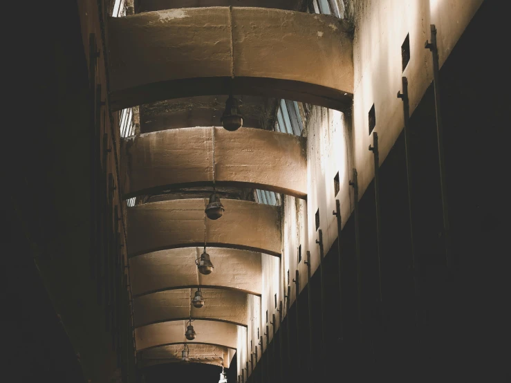 a view from underneath some modern buildings that appear like umbrellas