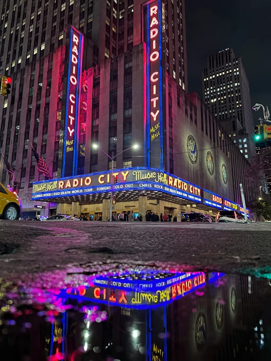 a el sign lit up at night in the city