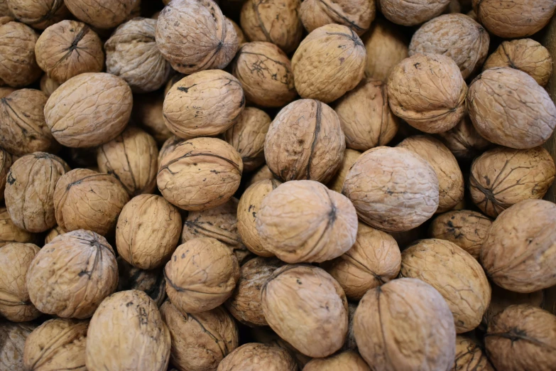 some walnuts that are in a pile together