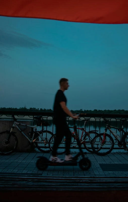 a man riding on the back of a scooter