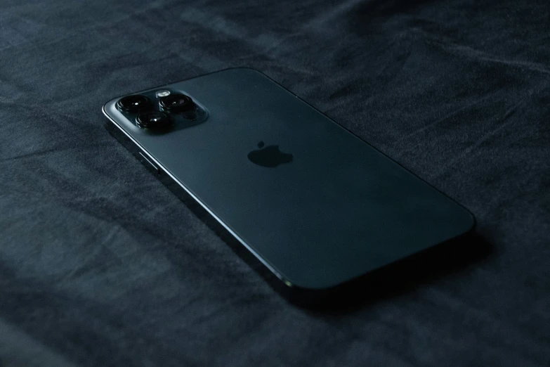 an apple phone with a microphone in the back