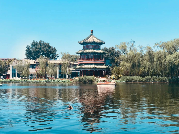 a house sits next to a body of water