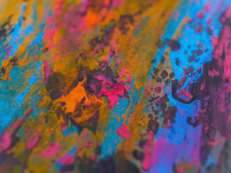 colorful, abstract painting with drops of paint on the bottom