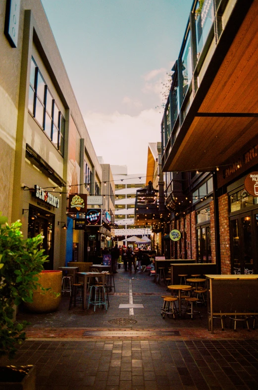 an empty courtyard filled with tables and chairs