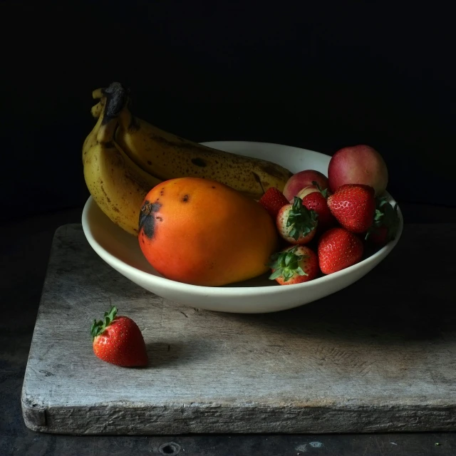 a bowl filled with different types of fruits