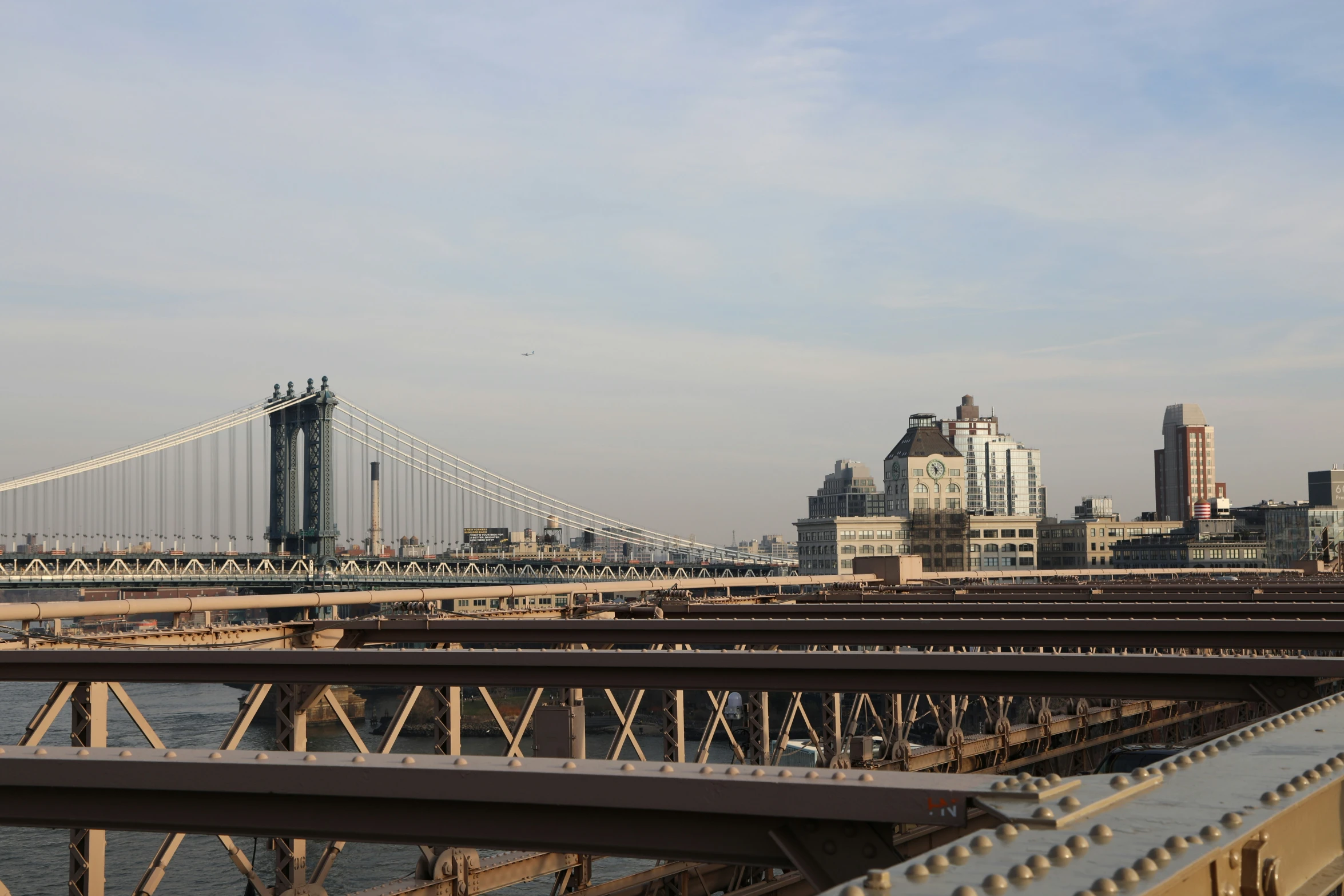 some bridge that is crossing the water with some buildings