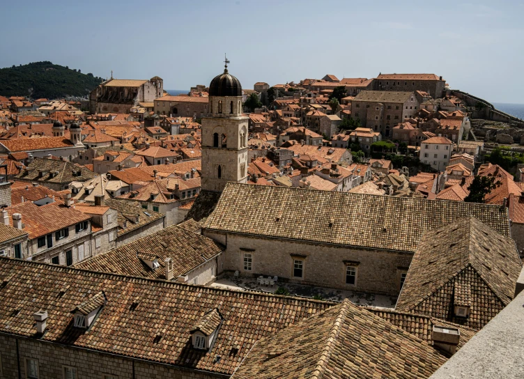 view of rooftops and city with a blue sky