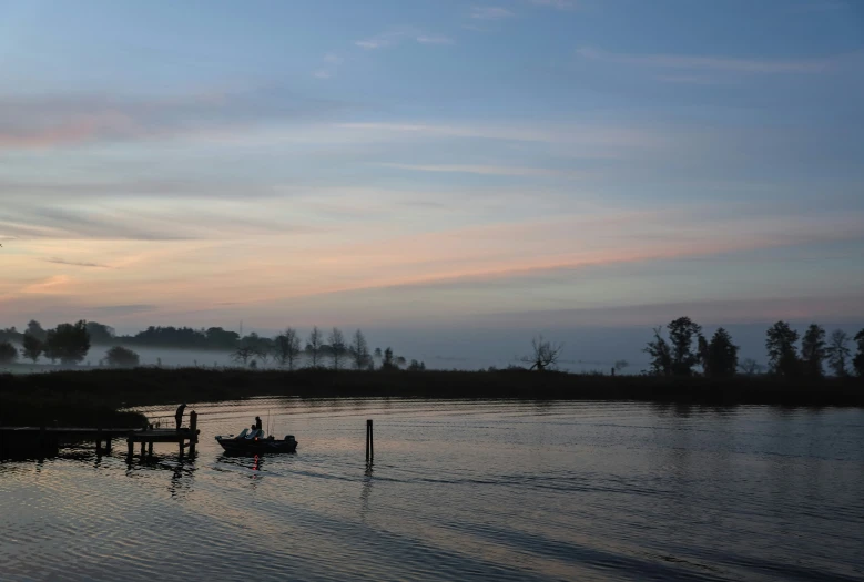 some boats are parked on the bank of the river