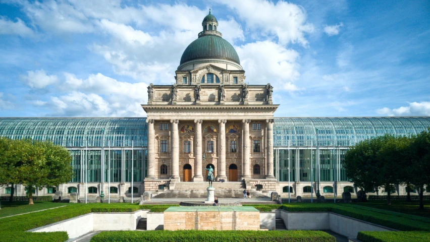 a very big beautiful building with a tall glass door