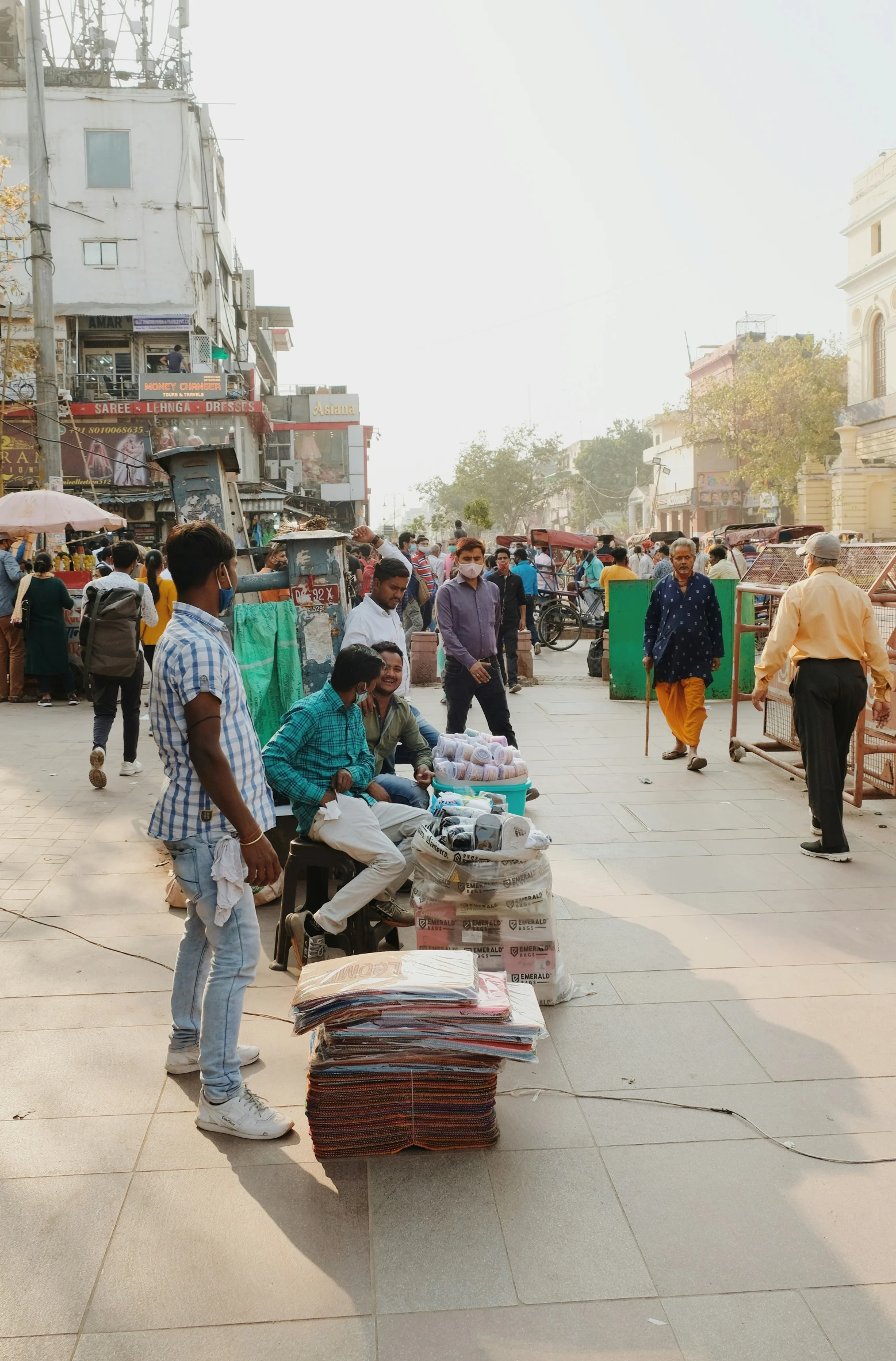 men are standing in the market place