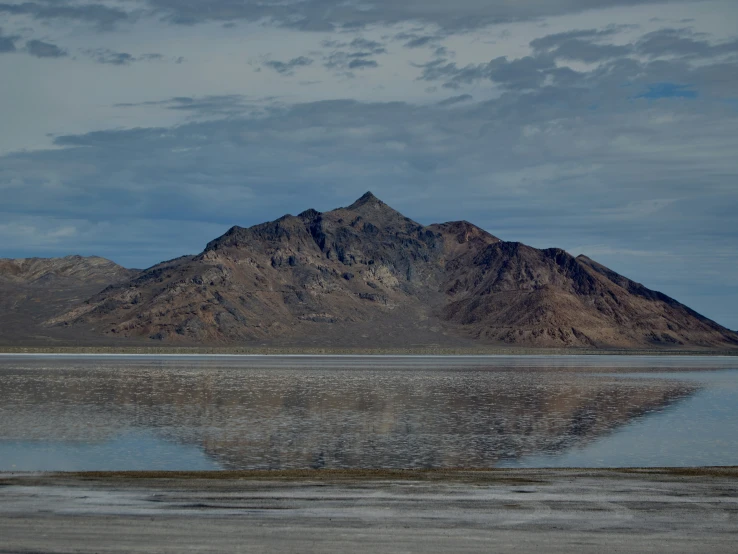 a lake with a large mountain in the background