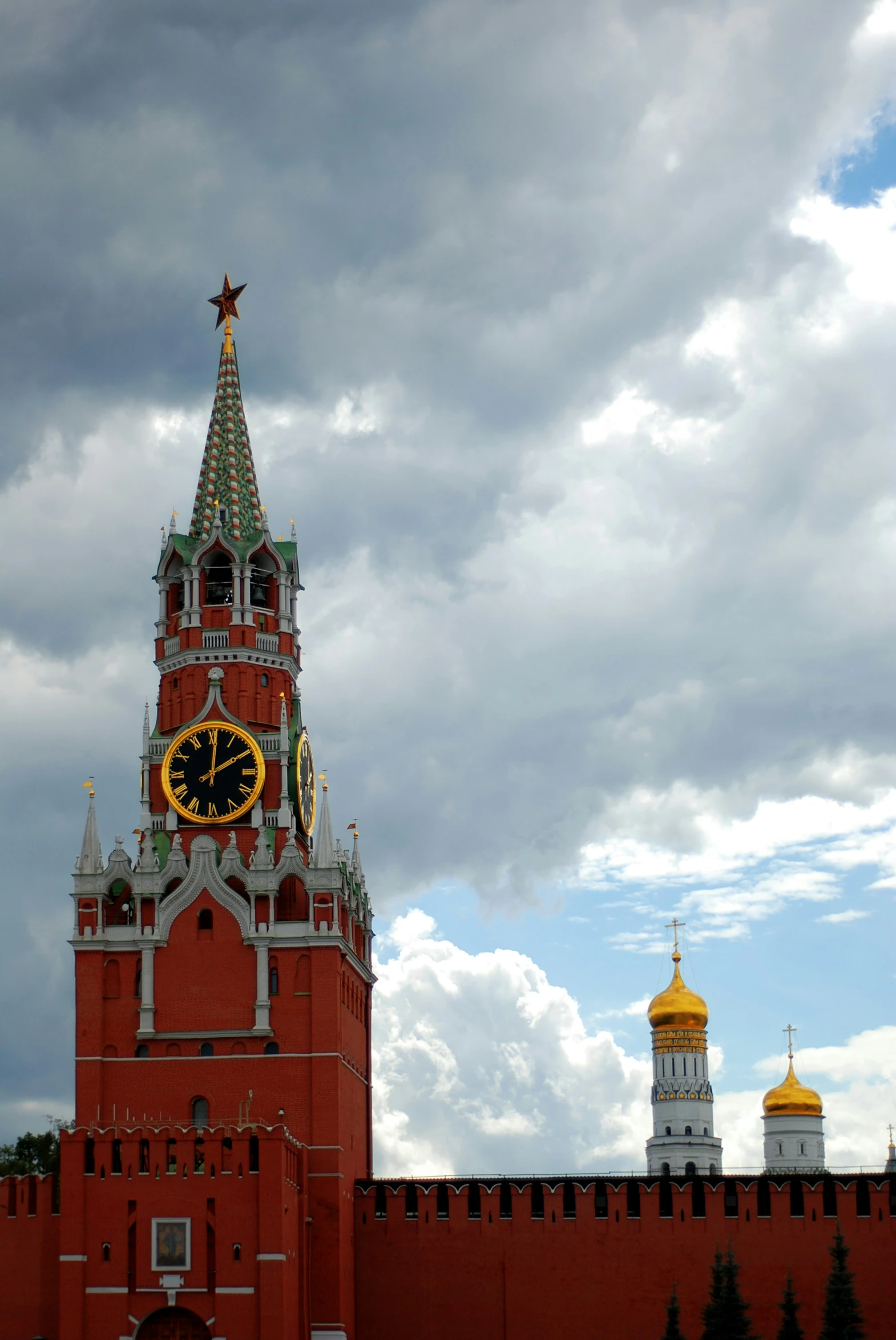 the clock tower has gold stars on it