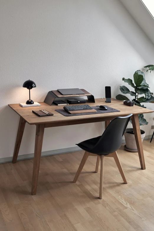 this is an interior po of a desk with a laptop and printer