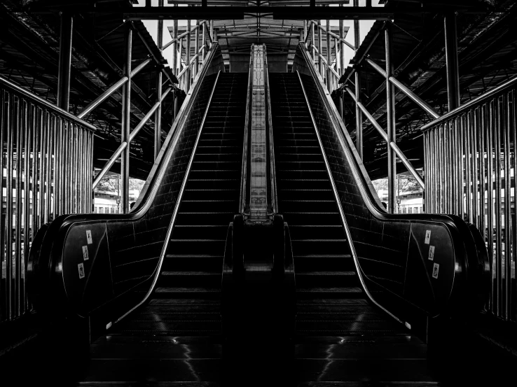 an empty escalator with the steps going up