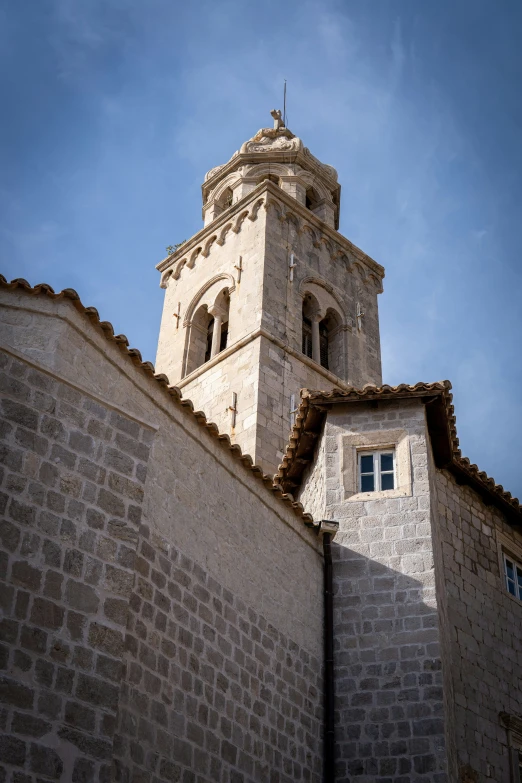 the tall clock tower rises into the sky