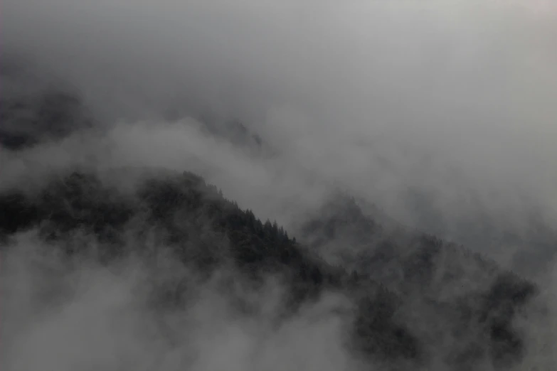 the view from the airplane as it flies over the clouds