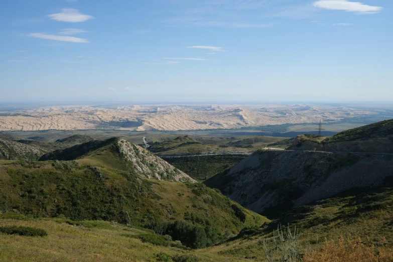 the view from the top of a mountain, looking out over a valley