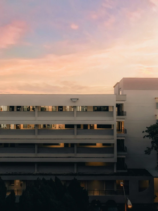 sunset with view from rooftop on building at building with balconies