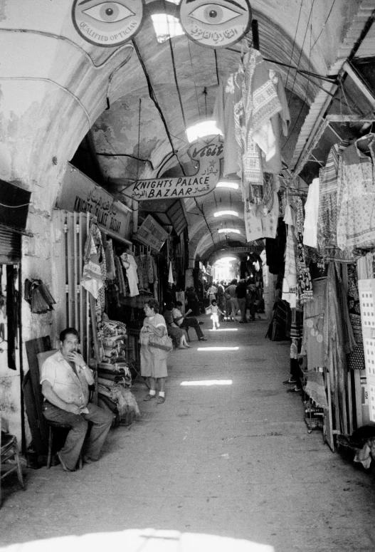 a black and white po of shops on the road