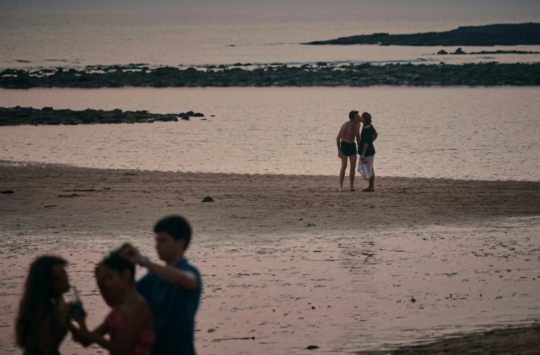 three people are standing in the water