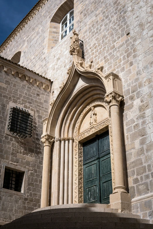 a tall church has arched archways and arches on it