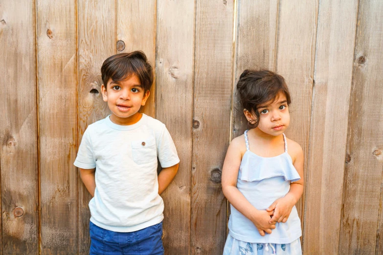 two little girls standing next to each other