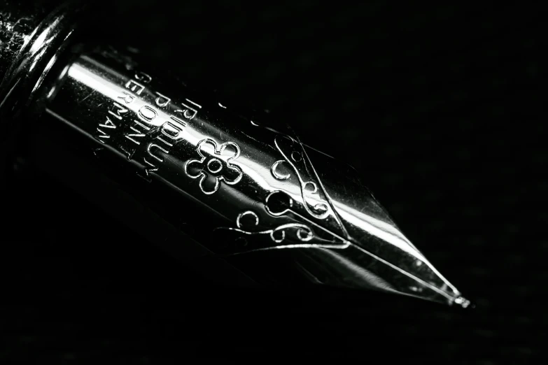 black and white pograph of an ornate fountain pen
