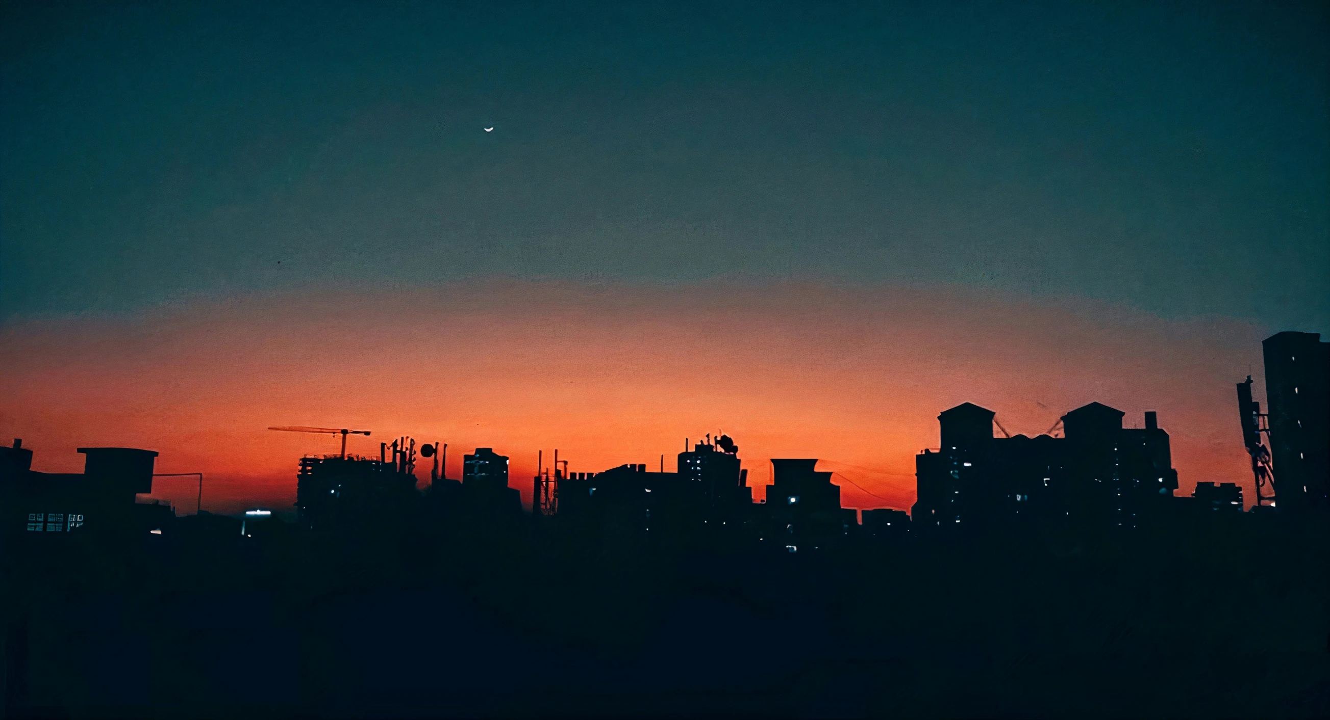 city skyline at sunset on an overcast day