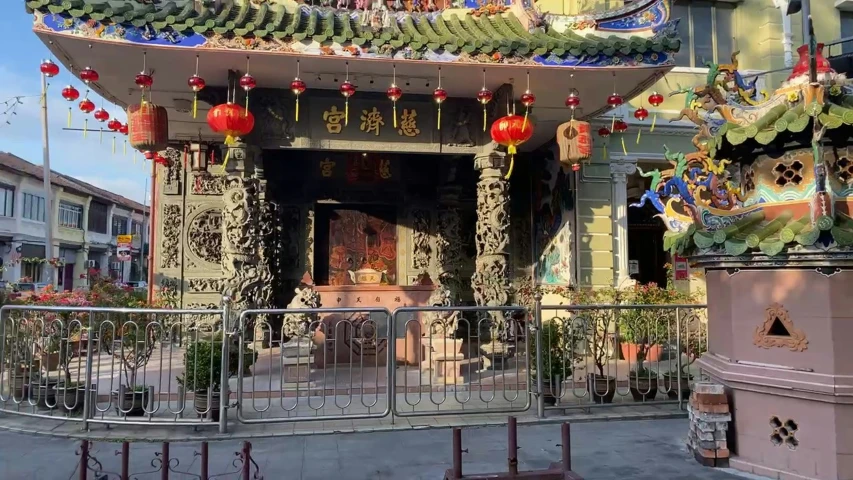 an outdoor chinese restaurant with colorful decorations