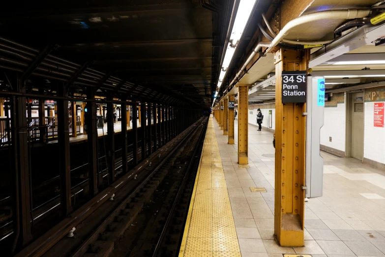 there is a yellow line that stretches along the train tracks