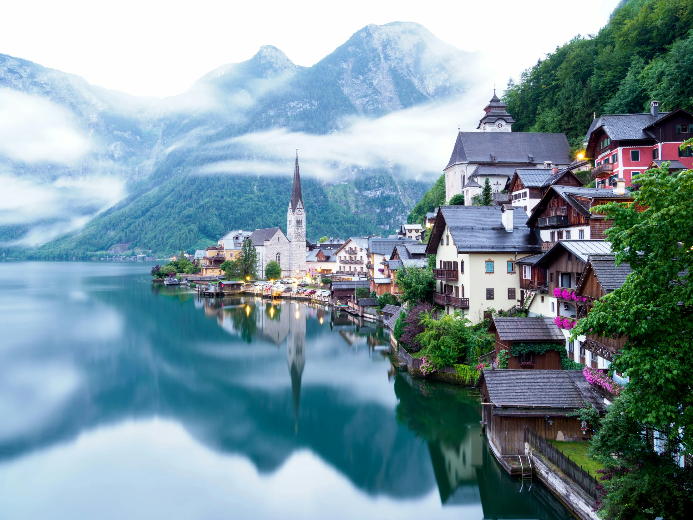 a small town is sitting next to a body of water