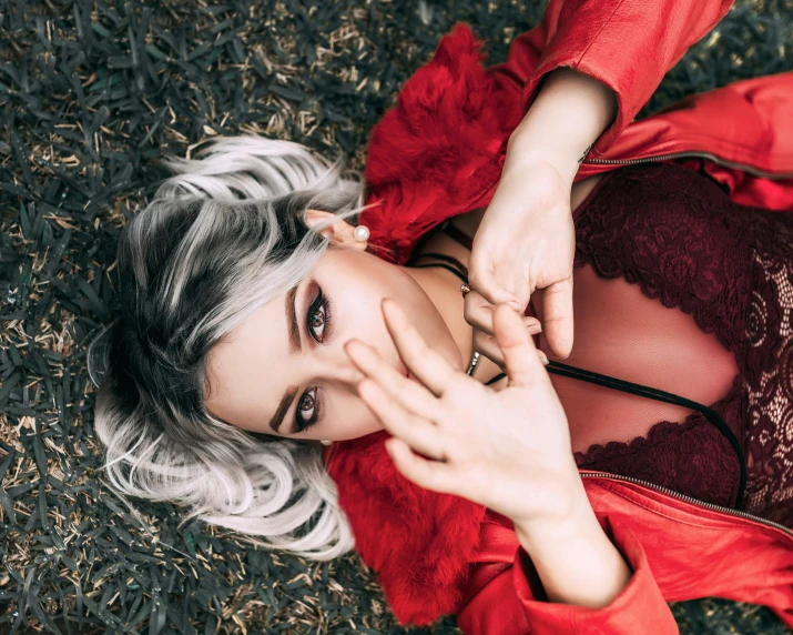 a beautiful woman posing in a red dress